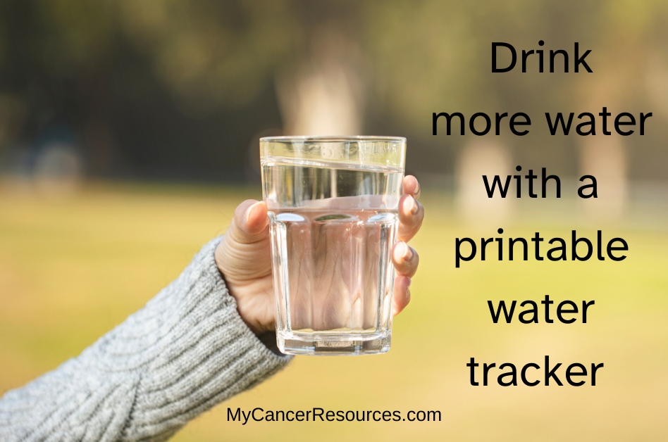 woman holding glass of water next to text saying drink more water with a printable water drinking chart